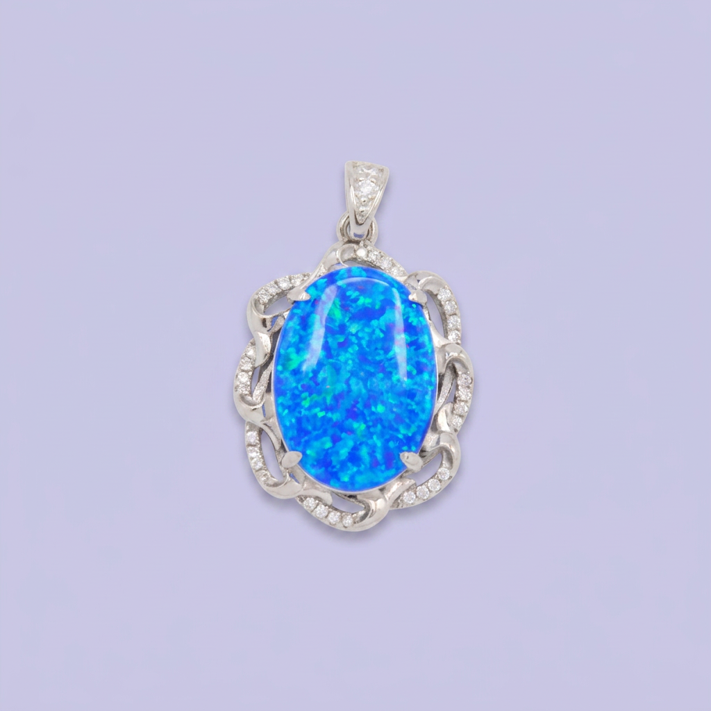 Dije de Plata .925 con Diseño Elegante Incrustado con Zirconias y Ópalo Azul mod. 2888