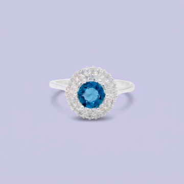 Anillo de Plata .925 con Diseño Circular con Zirconia Color Azul Cielo Central mod. 3103